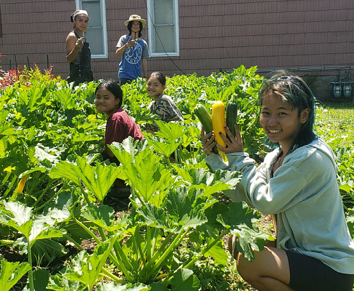 people in the garden at 5 Loaves Farm